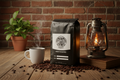 Coffee bag with a cup and lantern on a wooden table against a brick wall.